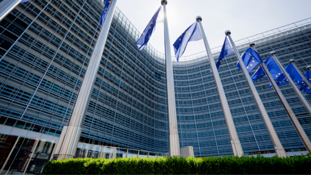 European Union flags wave outside the European Commission building in Brussels