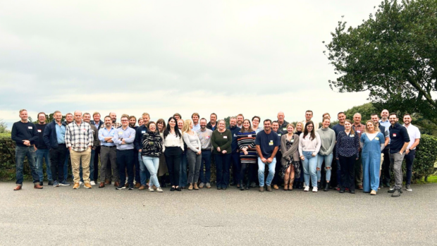 A group of over 40 people stands together at the fisheries management pilot event in Cornwall.