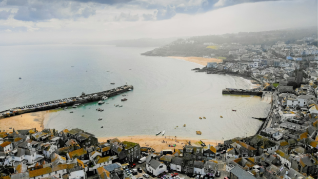 An aerial view of a city and the ocean